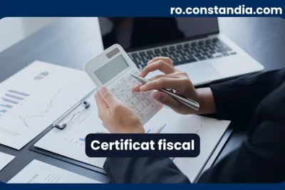 Certificat fiscal – calcul cu documente și rapoarte financiare pe birou.